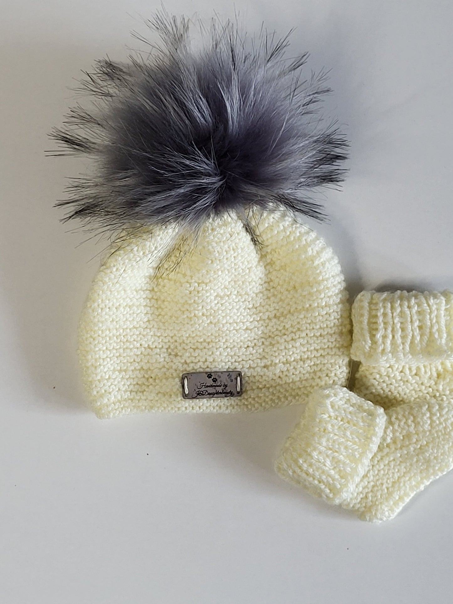 Knitted baby beanie hats and baby boots set