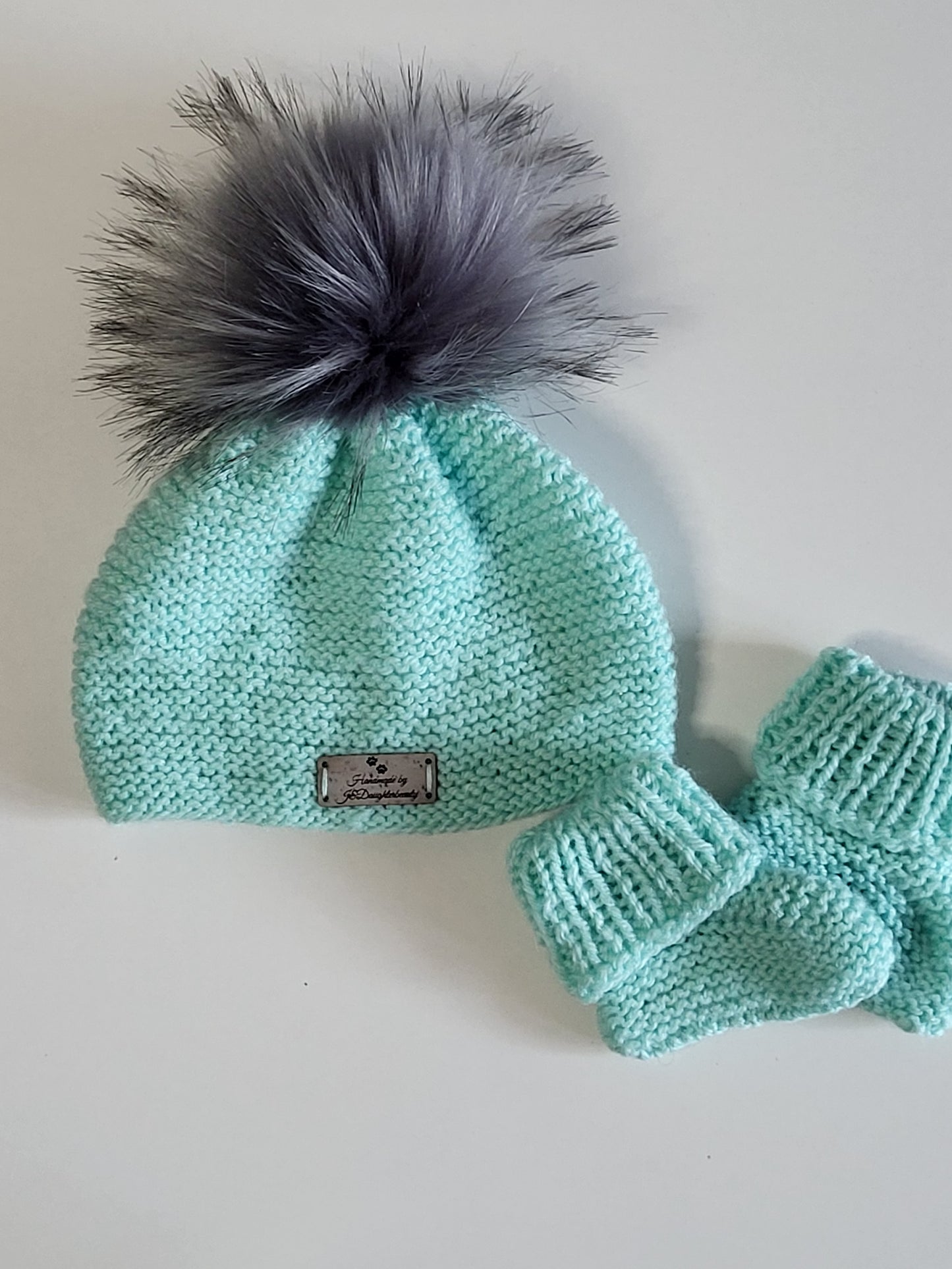 Knitted baby beanie hats and baby boots set